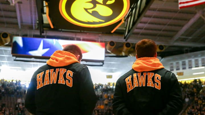 Iowa's men's wrestling team looks to the flag for the National Anthem prior to the dual against Wisconsin on Sunday, Feb. 18, 2024, at Carver-Hawkeye Arena in Iowa City, Iowa. Iowa's men's wrestling team looks to the flag for the National Anthem prior to the dual against Wisconsin on Sunday, Feb. 18, 2024, at Carver-Hawkeye Arena in Iowa City, Iowa.