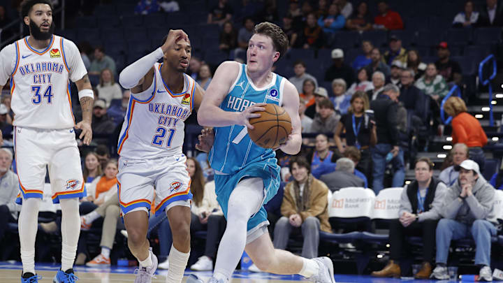 Jan 5, 2026; Oklahoma City, Oklahoma, USA; Charlotte Hornets guard Kon Knueppel (7) drives to the basket past Oklahoma City Thunder guard Aaron Wiggins (21) during the second half at Paycom Center. Mandatory Credit: Alonzo Adams-Imagn Images Jan 5, 2026; Oklahoma City, Oklahoma, USA; Charlotte Hornets guard Kon Knueppel (7) drives to the basket past Oklahoma City Thunder guard Aaron Wiggins (21) during the second half at Paycom Center. Mandatory Credit: Alonzo Adams-Imagn Images
