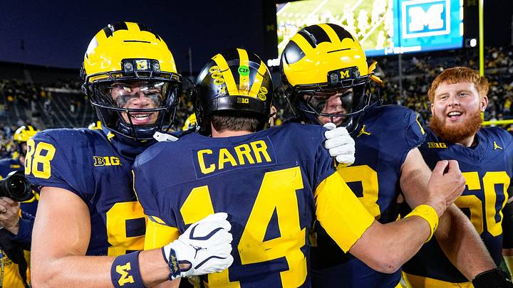 Michigan quarterback Tommy Carr (14) is congratulated by teammates after 21-18 win over Penn State at Michigan Stadium in Ann Arbor on Saturday, Oct. 17, 2026. Michigan quarterback Tommy Carr (14) is congratulated by teammates after 21-18 win over Penn State at Michigan Stadium in Ann Arbor on Saturday, Oct. 17, 2026.