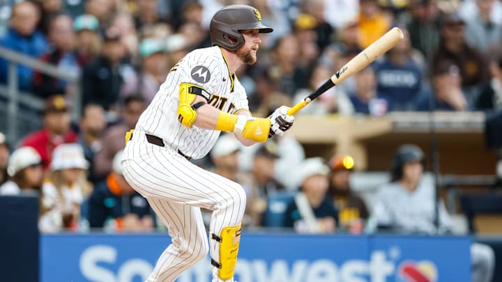 May 2, 2026; San Diego, California, USA; San Diego Padres second baseman Jake Cronenworth (9) hits a single during the fifth inning against the Chicago White Sox at Petco Park. Mandatory Credit: David Frerker-Imagn Images