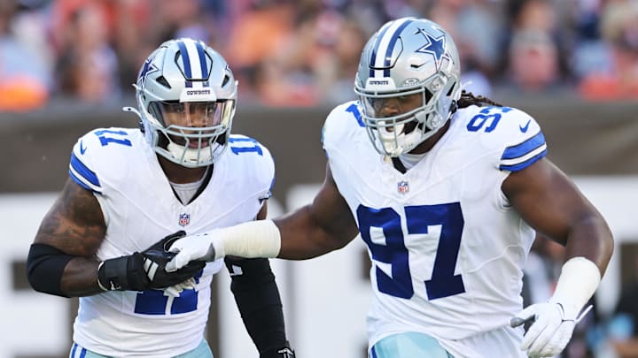 Dallas Cowboys stars Micah Parsons and Osa Odighizuwa celebrate after a sack against the Cleveland Browns 