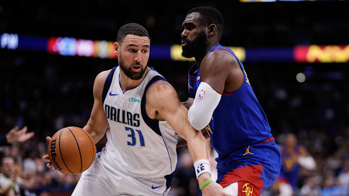 Dec 1, 2025; Denver, Colorado, USA; Dallas Mavericks guard Klay Thompson (31) controls the ball under pressure from Denver Nuggets guard Tim Hardaway Jr. (10) in the fourth quarter at Ball Arena. Mandatory Credit: Isaiah J. Downing-Imagn Images