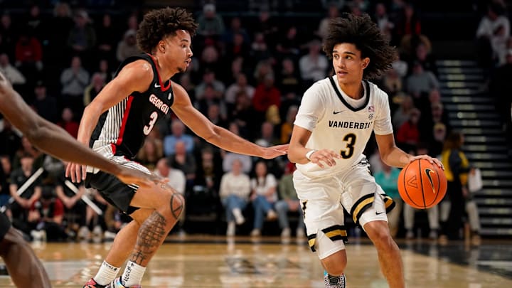Vanderbilt guard Tyler Tanner (3) pushes up the court with Georgia guard Jordan Ross (3) during the second half at Memorial Gym in Nashville, Tenn., Wednesday, Feb. 25, 2026.