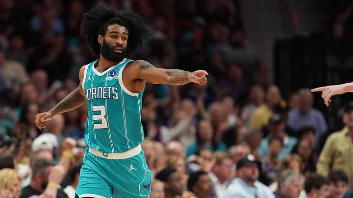 Charlotte Hornets guard Coby White (3) acknowledges an assist from guard/forward Kon Knueppel 