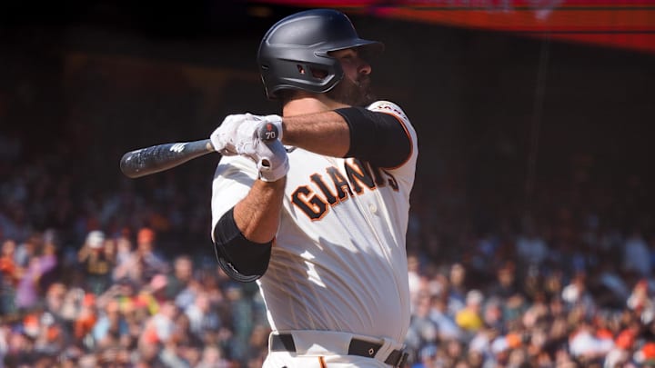 May 1, 2022; San Francisco, California, USA; San Francisco Giants first baseman Mike Ford (70) hits a two run RBI single against the Washington Nationals during the seventh inning at Oracle Park. Mandatory Credit: Kelley L Cox-Imagn Images