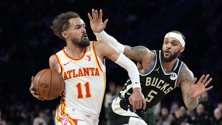 Dec 14, 2024; Las Vegas, Nevada, USA; Atlanta Hawks guard Trae Young (11) controls the ball against Milwaukee Bucks guard Gary Trent Jr. (5) during the first half in a semifinal of the 2024 Emirates NBA Cup at T-Mobile Arena. Mandatory Credit: Kyle Terada-Imagn Images