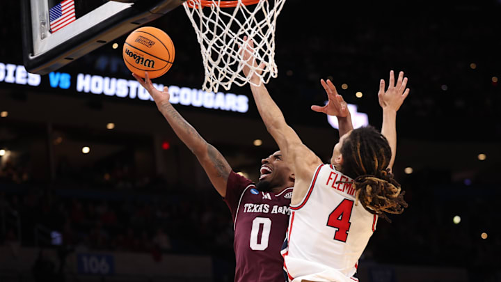Mar 21, 2026; Oklahoma City, OK, USA; Texas A&M Aggies guard Marcus Hill (0) drives to the hoop past Houston Cougars guard Kingston Flemings (4) during the second half of a second round game of the men's 2026 NCAA Tournament at Paycom Center. Mandatory Credit: William Purnell-Imagn Images