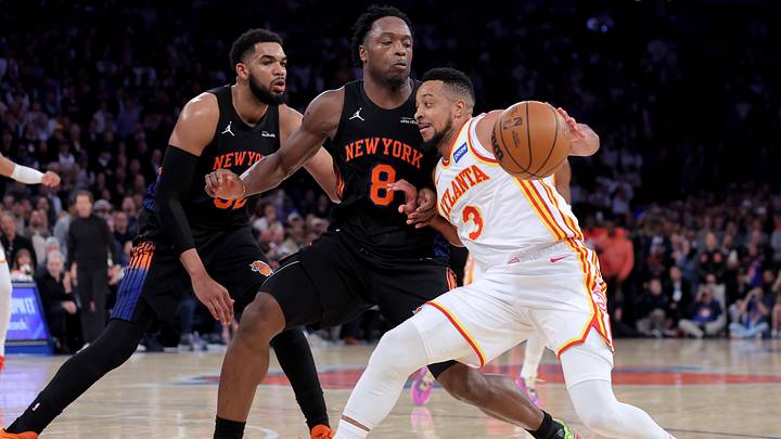 Apr 20, 2026; New York, New York, USA; Atlanta Hawks guard CJ McCollum (3) controls the ball against New York Knicks forward OG Anunoby (8) and center Karl-Anthony Towns (32) during the fourth quarter of game two of the first round of the 2026 NBA Playoffs at Madison Square Garden. Mandatory Credit: Brad Penner-Imagn Images