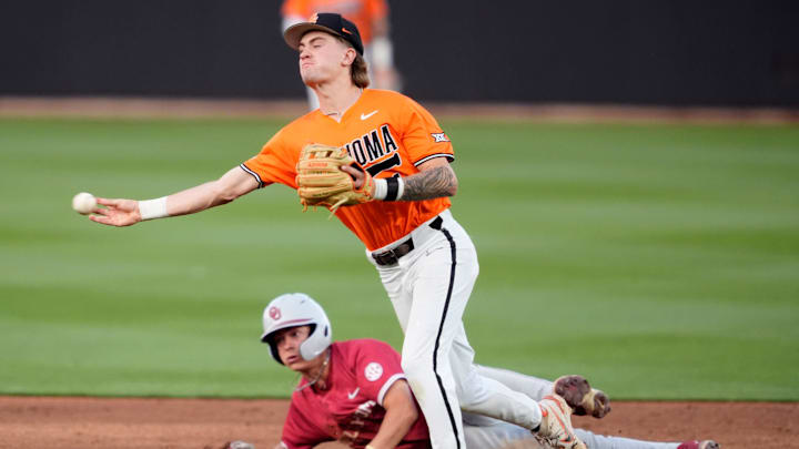 Oklahoma infielder Kyle Branch (6) slides o second as Oklahoma State infielder Brock Thompson (1) throws to third but is unable to get the out in the fifth inning of a college Bedlam baseball game between the University of Oklahoma Sooners (OU) and the Oklahoma State University Cowboys (OSU) at O'Brate Stadium in Stillwater, Okla., Tuesday, April 15, 2025.