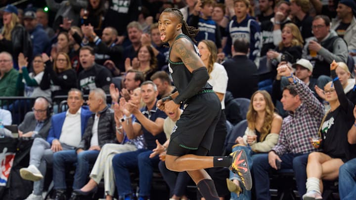Apr 25, 2026; Minneapolis, Minnesota, USA; Minnesota Timberwolves guard Ayo Dosunmu (13) reacts after hitting a three-point shot against the Denver Nuggets in the first quarter at Target Center. Mandatory Credit: Matt Blewett-Imagn Images
