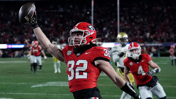 Georgia running back Cash Jones (32) scores during overtime of a NCAA college football game against Georgia Tech in Athens, Ga., on Friday, Nov. 29, 2024.