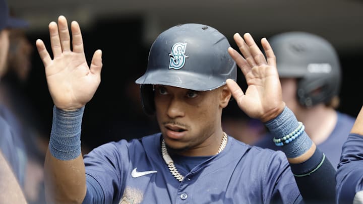 Seattle Mariners second base Jorge Polanco (7) celebrates with teammates after scoring against the Detroit Tigers in the first inning at Comerica Park on Aug 15.