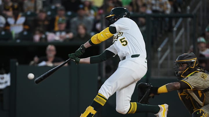 Apr 8, 2025; West Sacramento, California, USA; Athletics shortstop Jacob Wilson (5) hits an RBI single against the San Diego Padres during the first inning at Sutter Health Park. Mandatory Credit: Ed Szczepanski-Imagn Images Apr 8, 2025; West Sacramento, California, USA; Athletics shortstop Jacob Wilson (5) hits an RBI single against the San Diego Padres during the first inning at Sutter Health Park. Mandatory Credit: Ed Szczepanski-Imagn Images