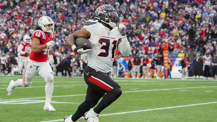 Oct 13, 2024; Foxborough, Massachusetts, USA; Houston Texans running back Dameon Pierce (31) runs with the ball for a touchdown against the New England Patriots during the second half at Gillette Stadium. Mandatory Credit: Gregory Fisher-Imagn Images