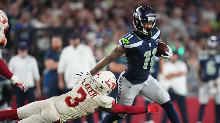 Arizona Cardinals safety Budda Baker (3) dives after Seattle Seahawks receiver Jaxon Smith-Njigba (11) at State Farm Stadium in Glendale on Sept. 25, 2025.