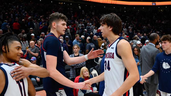 Dec 15, 2023; Seattle, Washington, USA; Connecticut Huskies center Donovan Clingan (32) and Gonzaga Bulldogs forward Braden Huff (34) shake hands after the game at Climate Pledge Arena Dec 15, 2023; Seattle, Washington, USA; Connecticut Huskies center Donovan Clingan (32) and Gonzaga Bulldogs forward Braden Huff (34) shake hands after the game at Climate Pledge Arena