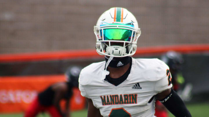 Mandarin wide receiver Jaime Ffrench Jr. (2) runs through warm-ups before the FHSAA Class 4M high school football championship game against Miami Columbus on December 8, 2023. [Clayton Freeman/Florida Times-Union]