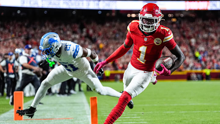 Kansas City Chiefs wide receiver Xavier Worthy (1) makes a catch for a touchdown against Detroit Lions cornerback Amik Robertson (21) during the first half at Arrowhead Stadium in Kansas City, Missouri on Sunday, Oct. 12, 2025.