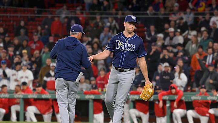 May 16, 2024; Boston, Massachusetts, USA;  Tampa Bay Rays manager Kevin Cash (16) relieves pitcher Jason Adam.