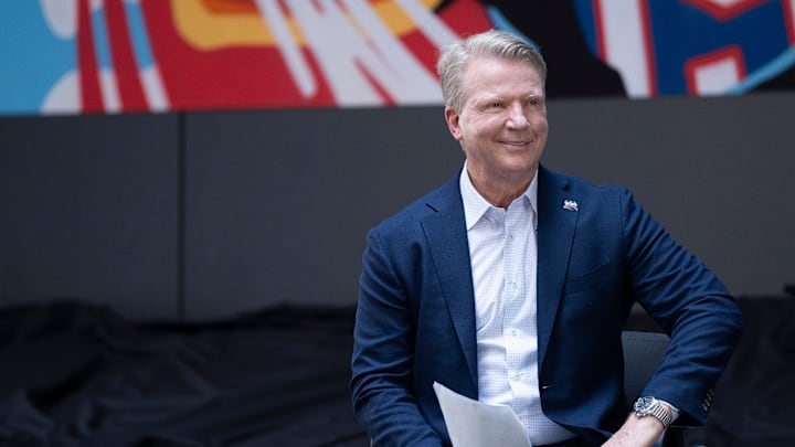 Aug 1, 2024; Hackensack, NJ, USA; Former Giants quarterback Phil Simms during a ceremony to unveil a mural celebrating the New York Giants 100th season at Hackensack University Medical Center. Aug 1, 2024; Hackensack, NJ, USA; Former Giants quarterback Phil Simms during a ceremony to unveil a mural celebrating the New York Giants 100th season at Hackensack University Medical Center.