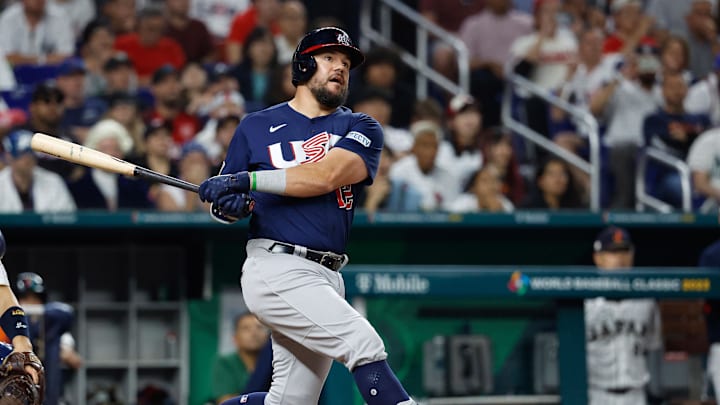 Mar 21, 2023; Miami, Florida, USA; USA designated hitter Kyle Schwarber (12) hits a home run against Japan in the eighth inning at LoanDepot Park.