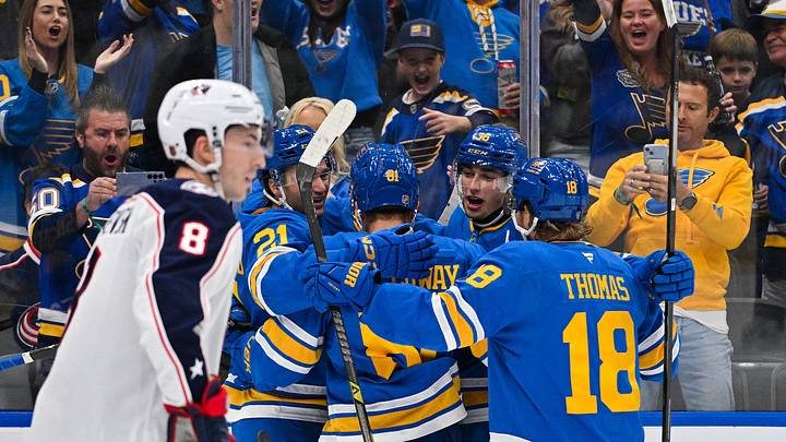 Oct 10, 2026; St. Louis, Missouri, USA; St. Louis Blues right wing Jimmy Snuggerud (21) celebrates with teammates after scoring against the Columbus Blue Jackets during the second period at Enterprise Center. Mandatory Credit: Jeff Curry-Imagn Images Oct 10, 2026; St. Louis, Missouri, USA; St. Louis Blues right wing Jimmy Snuggerud (21) celebrates with teammates after scoring against the Columbus Blue Jackets during the second period at Enterprise Center. Mandatory Credit: Jeff Curry-Imagn Images