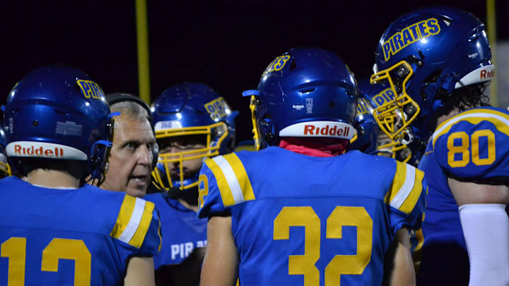 Crystal River head coach Bill Vonada talks with his offense during a timeout in an Oct. 4, 2024 home game against The Villages. 