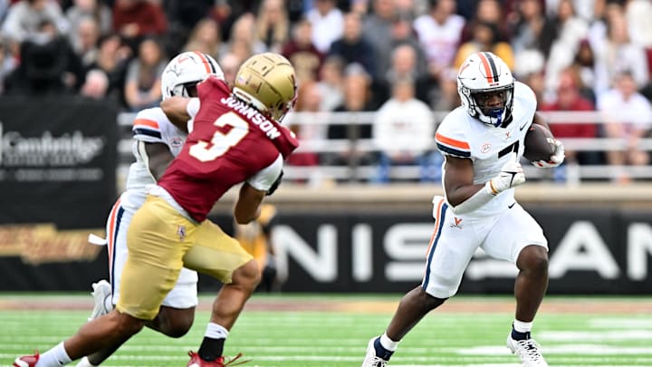 Sep 30, 2023; Chestnut Hill, Massachusetts, USA; Virginia Cavaliers running back Mike Hollins (7) rushes against Boston College Eagles defensive back Khari Johnson (3) during the first half at Alumni Stadium. Mandatory Credit: Brian Fluharty-Imagn Images