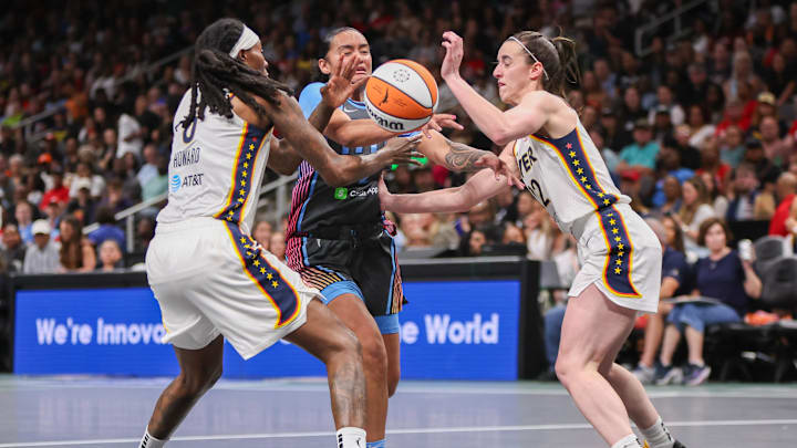 May 22, 2025; Atlanta, Georgia, USA; Atlanta Dream guard Te-Hina Paopao (2) is defended by Indiana Fever forward Natasha Howard (6) and guard Caitlin Clark (22) in the first half at State Farm Arena. Mandatory Credit: Brett Davis-Imagn Images May 22, 2025; Atlanta, Georgia, USA; Atlanta Dream guard Te-Hina Paopao (2) is defended by Indiana Fever forward Natasha Howard (6) and guard Caitlin Clark (22) in the first half at State Farm Arena. Mandatory Credit: Brett Davis-Imagn Images