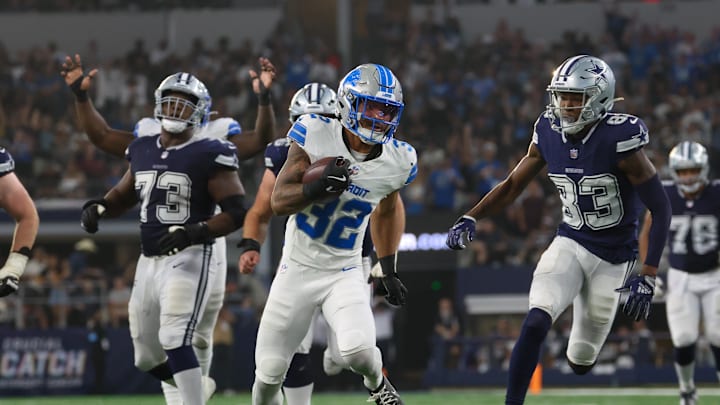 Oct 13, 2024; Arlington, Texas, USA; Detroit Lions safety Brian Branch (32) returns an interception during the second half against the Dallas Cowboys  at AT&T Stadium. Mandatory Credit: Kevin Jairaj-Imagn Images