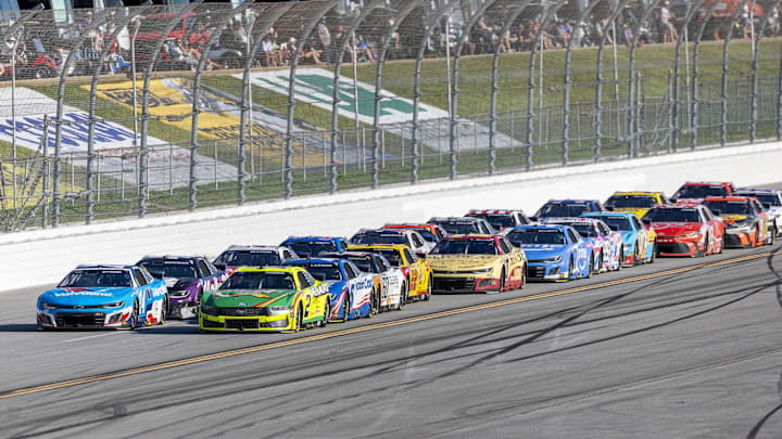 Apr 27, 2025; Talladega, Alabama, USA; NASCAR Cup Series drivers William Byron (24) and Austin Cindric (2) battle for the lead late during stage three of the NASCAR: Jack Link's 500 at Talladega Superspeedway.