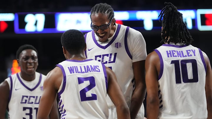 GCU Lopes guard Makaih Williams (2) celebrates with teammate Dennis Evans (14) after his slam dunk while being fouled against the Colorado State Rams at GCU Arena in Phoenix, on Jan. 3, 2026.