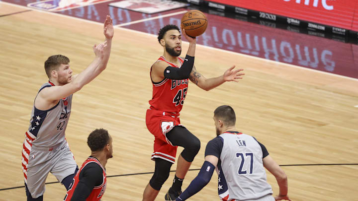 Feb 8, 2021; Chicago, Illinois, USA; Chicago Bulls guard Denzel Valentine (45) shoots against Washington Wizards center Alex Len (27) during the first half of an NBA game at United Center. Mandatory Credit: Kamil Krzaczynski-USA TODAY Sports