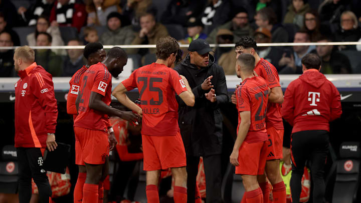 Vincent Kompany giving instructions to players during a break in the game between Bayern Munich and Eintracht Frankfurt.