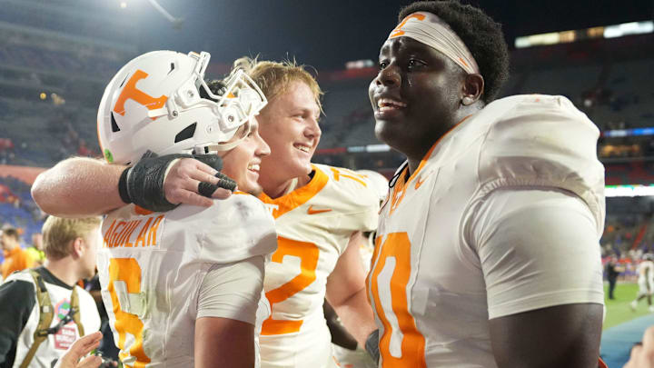 Tennessee quarterback Joey Aguilar (6), and offensive linemen Jesse Perry (72) and David Sanders Jr. (70) celebrating after the win over Florida in an NCAA college football game on November 22, 2025, in Gainesville, Florida. Tennessee quarterback Joey Aguilar (6), and offensive linemen Jesse Perry (72) and David Sanders Jr. (70) celebrating after the win over Florida in an NCAA college football game on November 22, 2025, in Gainesville, Florida.