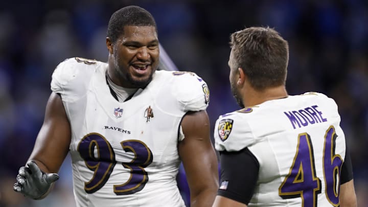 Sep 26, 2021; Detroit, Michigan, USA; Baltimore Ravens defensive end Calais Campbell (93) shares a laugh with long snapper Nick Moore (46) after the game against the Detroit Lions at Ford Field. Mandatory Credit: Raj Mehta-Imagn Images