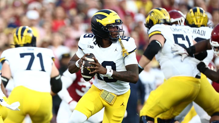 Sep 6, 2025; Norman, Oklahoma, USA; Michigan Wolverines quarterback Bryce Underwood (19) rolls out against the Oklahoma Sooners during the first half at Gaylord Family-Oklahoma Memorial Stadium. Mandatory Credit: Kevin Jairaj-Imagn Images