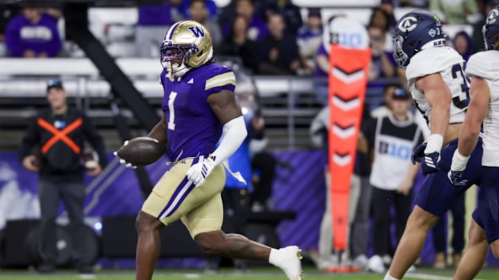 Sep 6, 2025; Seattle, Washington, USA; Washington Huskies running back Jonah Coleman (1) rushes for a touchdown against the UC Davis Aggies during the first quarter at Husky Stadium. Mandatory Credit: Joe Nicholson-Imagn Images