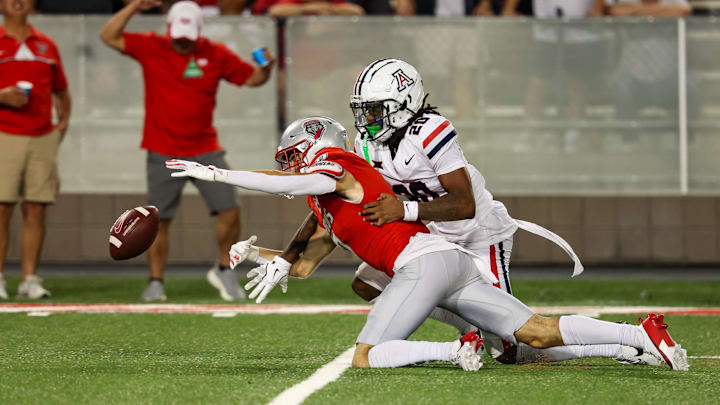 Aug 31, 2024; Tucson, Arizona, USA; Arizona Wildcats defensive back Marquis Groves-Killebrew (20) deflects catch from New Mexico Lobos wide receiver Nic Trujillo (7) during third quarter at Arizona Stadium. Mandatory Credit: Aryanna Frank-Imagn Images
