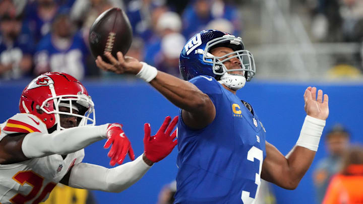 Sep 21, 2025; East Rutherford, New Jersey, USA; New York Giants quarterback Russell Wilson (3) throws under pressure from Kansas City Chiefs cornerback Jaylen Watson (35) in the second quarter at MetLife Stadium. 