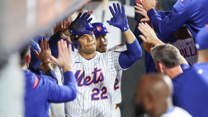 Aug 13, 2025; New York City, New York, USA;  New York Mets right fielder Juan Soto (22) is greeted in the dugout after hitting a two run home run in the second inning against the Atlanta Braves at Citi Field. Mandatory Credit: Wendell Cruz-Imagn Images