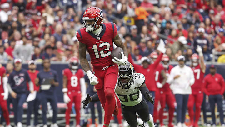 Nov 26, 2023; Houston, Texas, USA; Houston Texans wide receiver Nico Collins (12) runs with the ball
