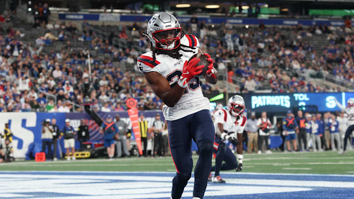 Aug 21, 2025; East Rutherford, New Jersey, USA; New England Patriots safety Kyle Dugger (23) interception a pass in the end zone during the first half against the New York Giants at MetLife Stadium. Mandatory Credit: Vincent Carchietta-Imagn Images