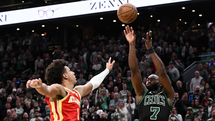 Jan 18, 2025; Boston, Massachusetts, USA; Boston Celtics guard Jaylen Brown (7) attempts a three-point basket against Atlanta Hawks forward Jalen Johnson (1) during the fourth quarter at the TD Garden. Mandatory Credit: Brian Fluharty-Imagn Images Jan 18, 2025; Boston, Massachusetts, USA; Boston Celtics guard Jaylen Brown (7) attempts a three-point basket against Atlanta Hawks forward Jalen Johnson (1) during the fourth quarter at the TD Garden. Mandatory Credit: Brian Fluharty-Imagn Images