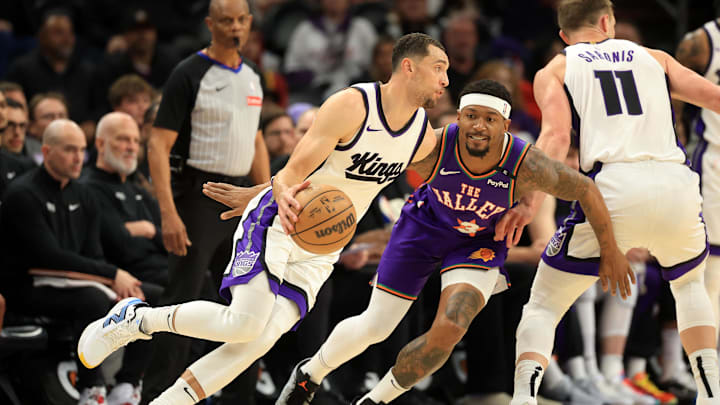 Mar 14, 2025; Phoenix, Arizona, USA; Sacramento Kings guard Zach LaVine (8) dribbles the ball against Phoenix Suns guard Bradley Beal (3) during the first half at Footprint Center. Mandatory Credit: Mark J. Rebilas-Imagn Images