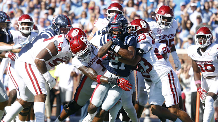 Oct 26, 2024; Oxford, Mississippi, USA; Mississippi Rebels running back Henry Parrish Jr. (21) runs the ball for a touchdown as Oklahoma Sooners linebacker Dasan McCullough (1) and defensive back Eli Bowen (23) attempt to make the tackle during the first half at Vaught-Hemingway Stadium. Mandatory Credit: Petre Thomas-Imagn Images Oct 26, 2024; Oxford, Mississippi, USA; Mississippi Rebels running back Henry Parrish Jr. (21) runs the ball for a touchdown as Oklahoma Sooners linebacker Dasan McCullough (1) and defensive back Eli Bowen (23) attempt to make the tackle during the first half at Vaught-Hemingway Stadium. Mandatory Credit: Petre Thomas-Imagn Images