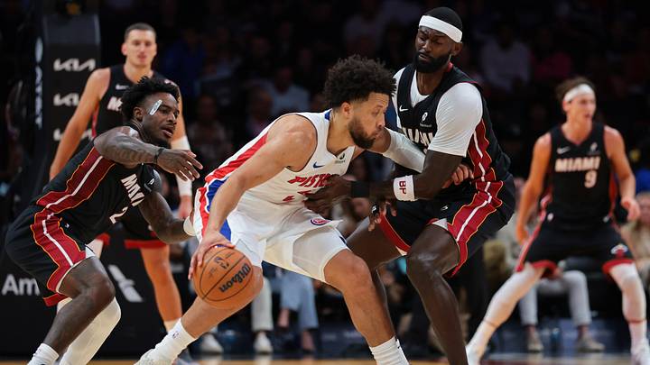 Oct 23, 2026; Miami, Florida, USA; Detroit Pistons guard Cade Cunningham (2) dribbles the basketball against Miami Heat forward Bobby Portis (95) and guard Davion Mitchell (2) during the second quarter at Kaseya Center. Mandatory Credit: Sam Navarro-Imagn Images Oct 23, 2026; Miami, Florida, USA; Detroit Pistons guard Cade Cunningham (2) dribbles the basketball against Miami Heat forward Bobby Portis (95) and guard Davion Mitchell (2) during the second quarter at Kaseya Center. Mandatory Credit: Sam Navarro-Imagn Images