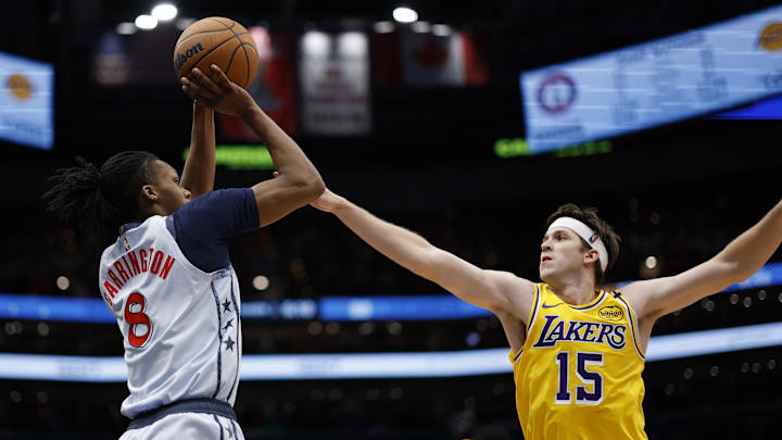 Jan 30, 2025; Washington, District of Columbia, USA; Washington Wizards guard Bub Carrington (8) shoots the ball over Los Angeles Lakers guard Austin Reaves (15) in the third quarter at Capital One Arena. Mandatory Credit: Geoff Burke-Imagn Images