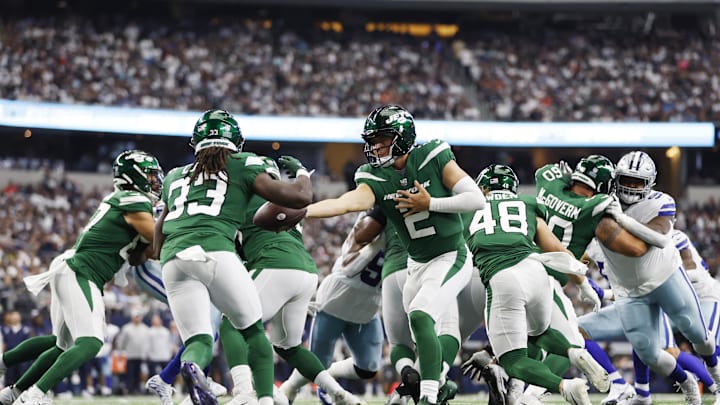 Sep 17, 2023; Arlington, Texas, USA; New York Jets quarterback Zach Wilson (2) hands off to running back Dalvin Cook (33) in the third quarter against the Dallas Cowboys at AT&T Stadium. Mandatory Credit: Tim Heitman-Imagn Images