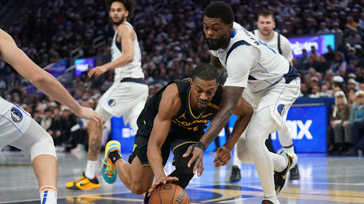 Nov 12, 2024; San Francisco, California, USA; Golden State Warriors guard De'Anthony Melton (8) loses control of the ball next to Dallas Mavericks forward Naji Marshall (13) in the fourth quarter at the Chase Center. Mandatory Credit: Cary Edmondson-Imagn Images